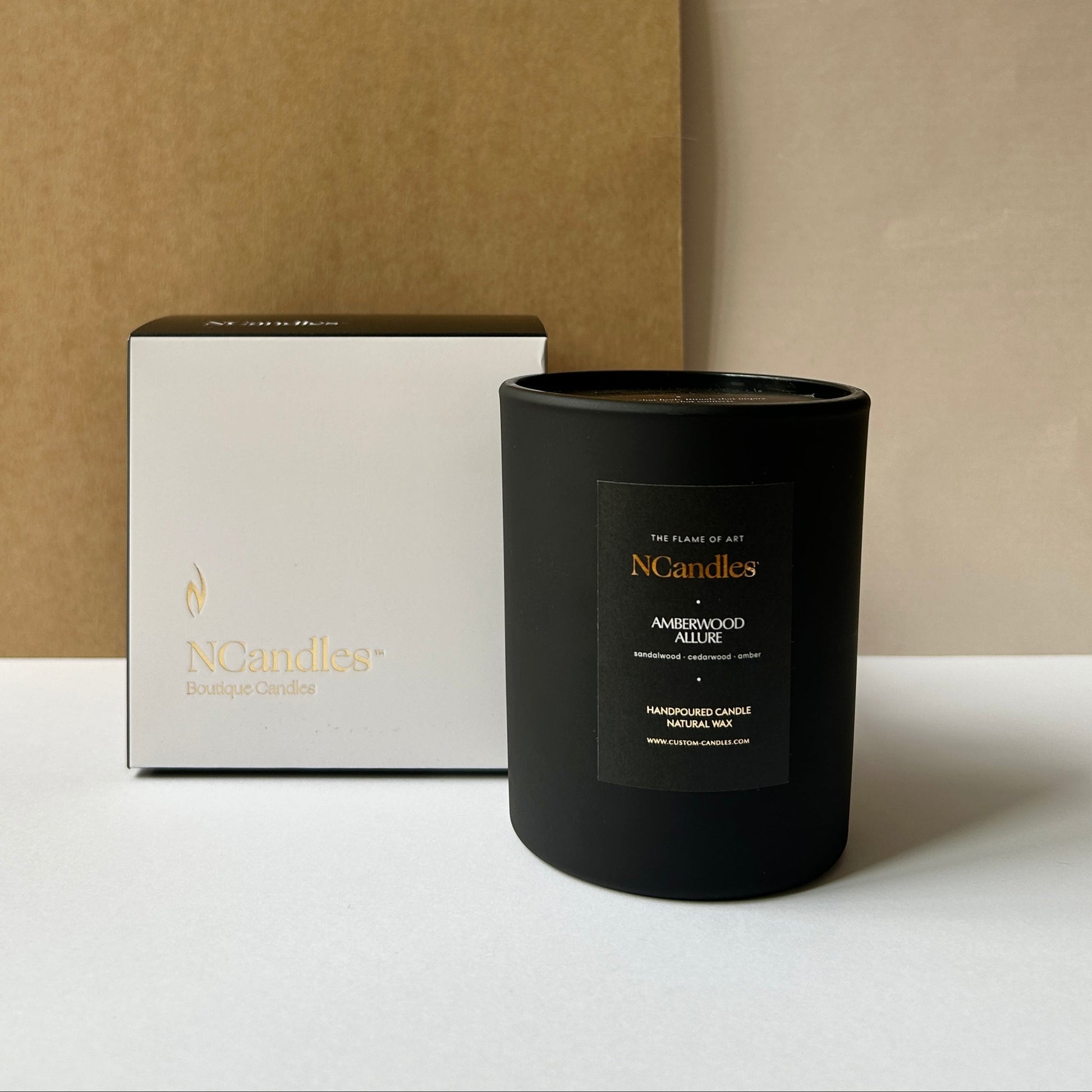 black candle with amberwood scent