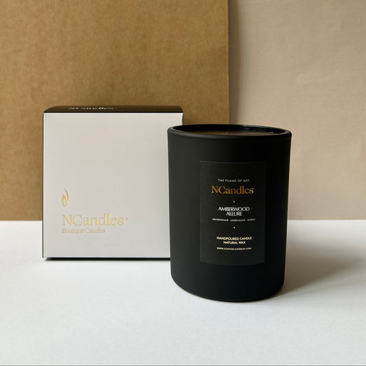 black candle with amberwood scent