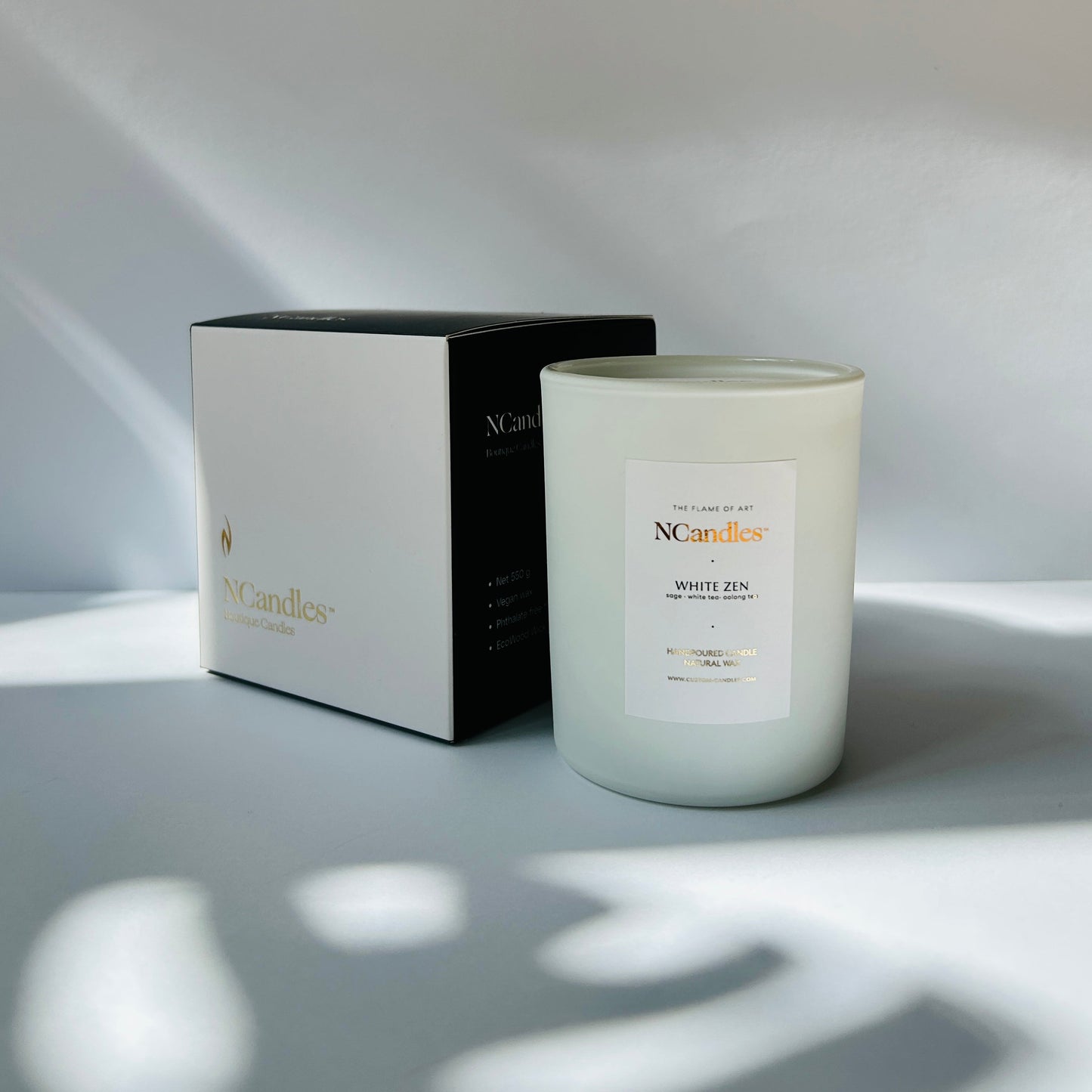 white candle whit black box